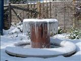 Memorial Sundial in situ by John Joekes, Sculpture, Slate, Copper and Purbeck Cap